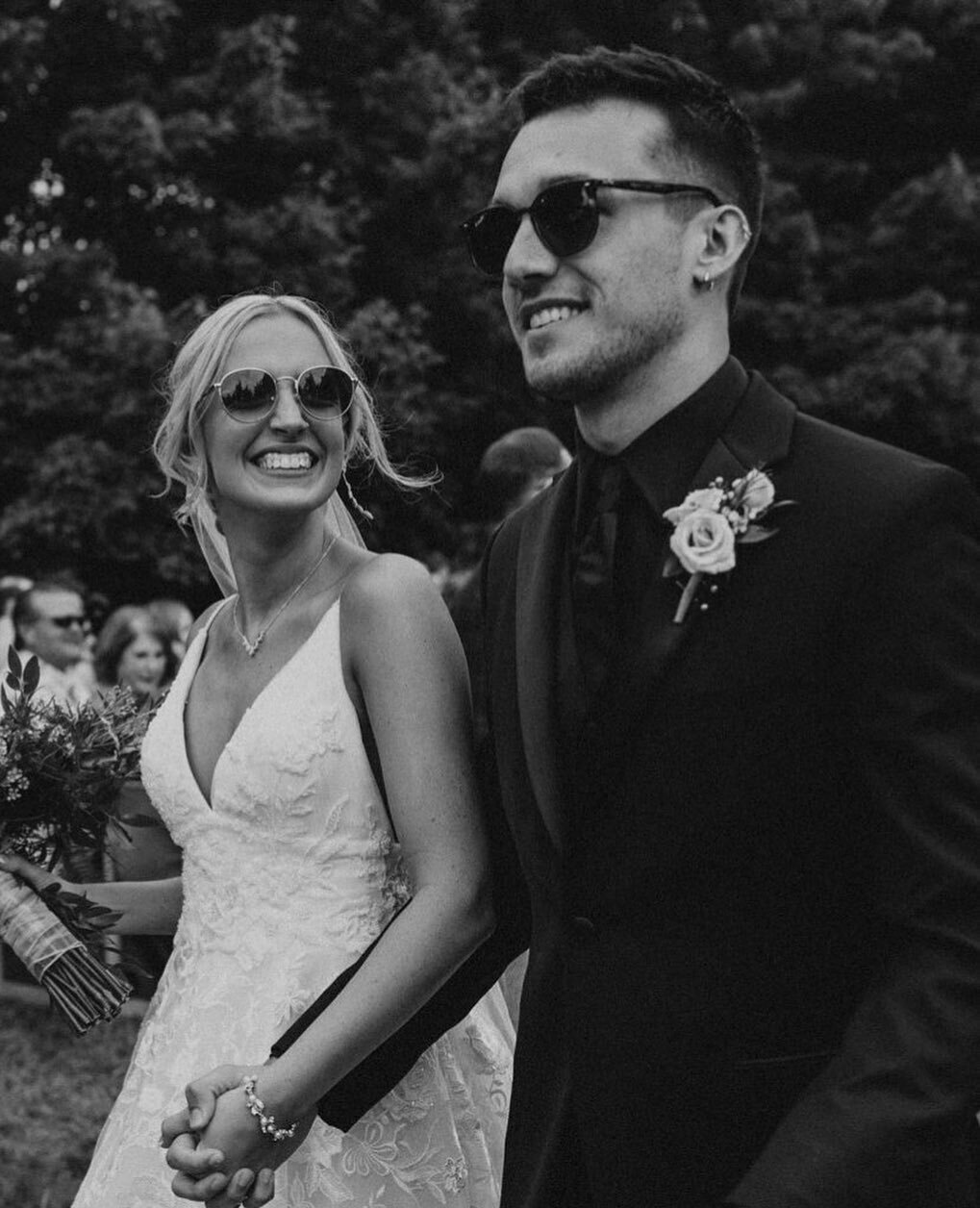 Lace bride and partner celebrating their wedding day